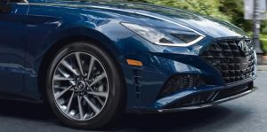 Close view of the front tire area of a blue 2021 Hyundai Sonata. | Hyundai service in Little Rock, AR.