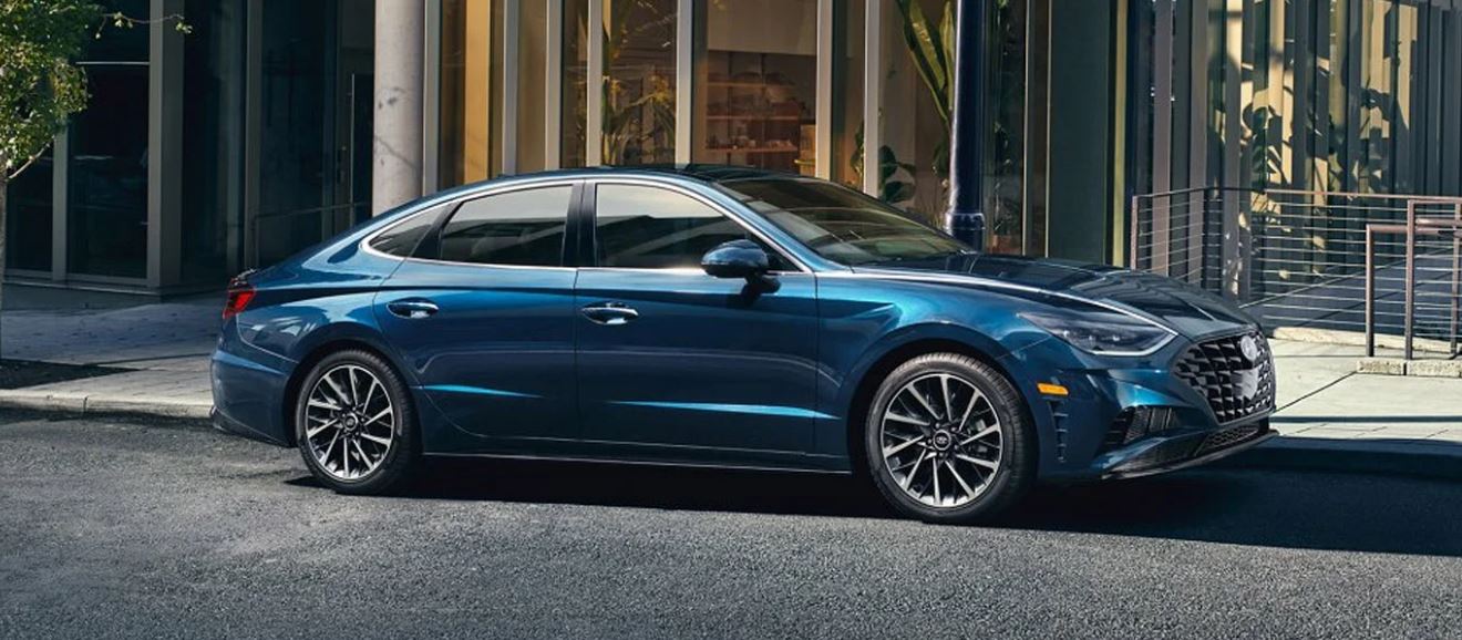 Blue Hyundai sedan parked outside a modern building in North Little Rock.