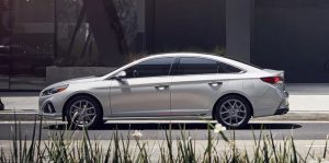 Profile view of a silver 2019 Hyundai Sonata parked on the street. | Hyundai dealer in North Little Rock, AR.