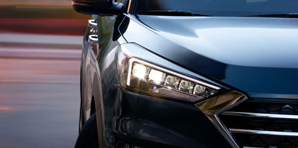 Close-up of a Hyundai headlight at dusk