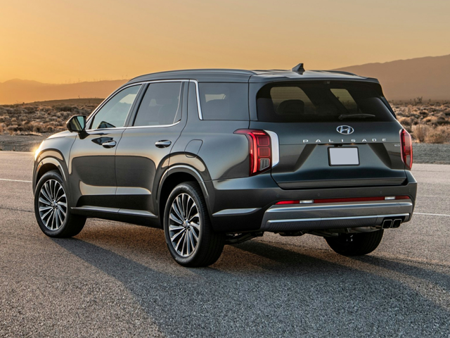 Rear angle view of a 2023 Hyundai Palisade SUV at sunset
