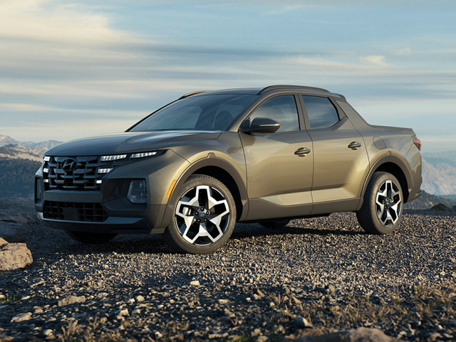 Front-side view of the Hyundai Santa Cruz parked on a rugged mountain terrain