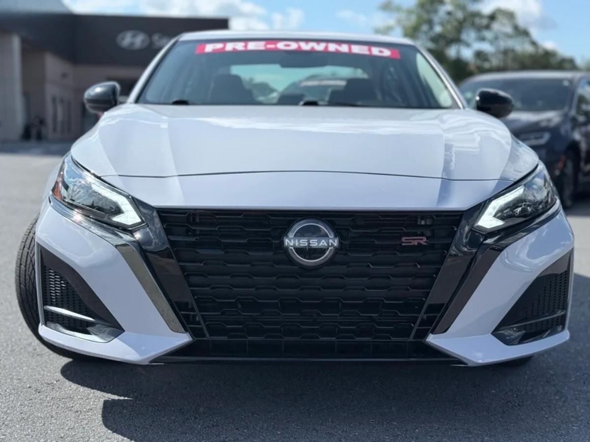 A pre-owned Nissan Altima sedan displayed at Crain Hyundai of North Little Rock, showing the types of vehicles customers can sell or trade through the Crain Buys Cars program.