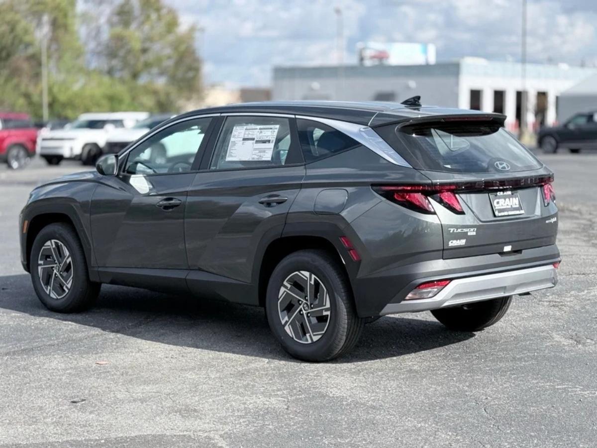 A dark gray 2026 Hyundai Tucson Hybrid on the lot at Crain Hyundai of North Little Rock, backed by America’s Best Warranty.
