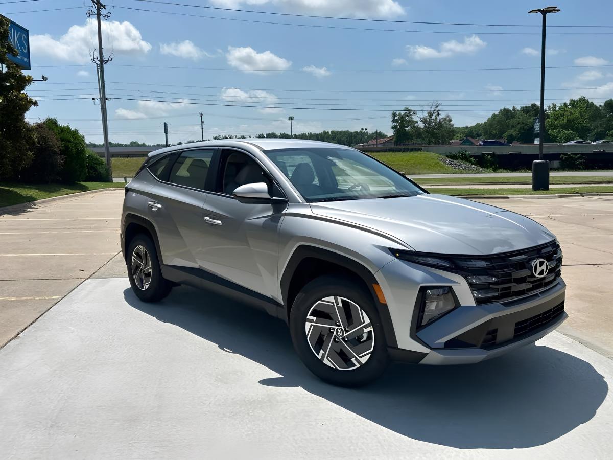 Silver Hyundai Tucson parked outside Crain Hyundai of North Little Rock dealership
